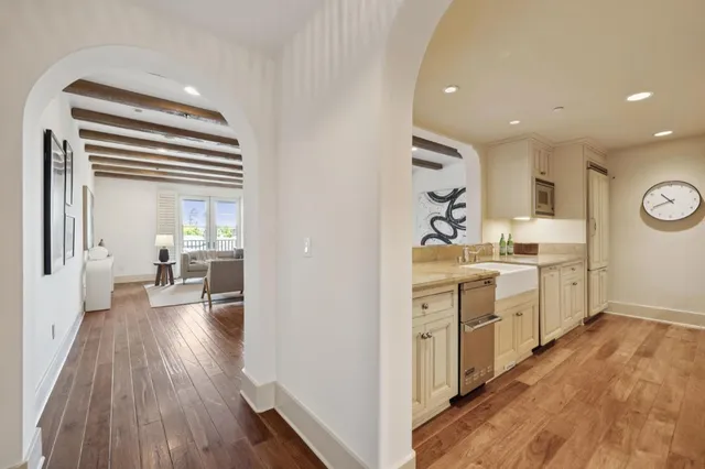 a kitchen with granite countertop a stove and a wooden cabinets