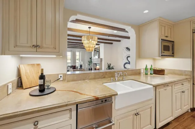 a view of a hallway with wooden floor and closet