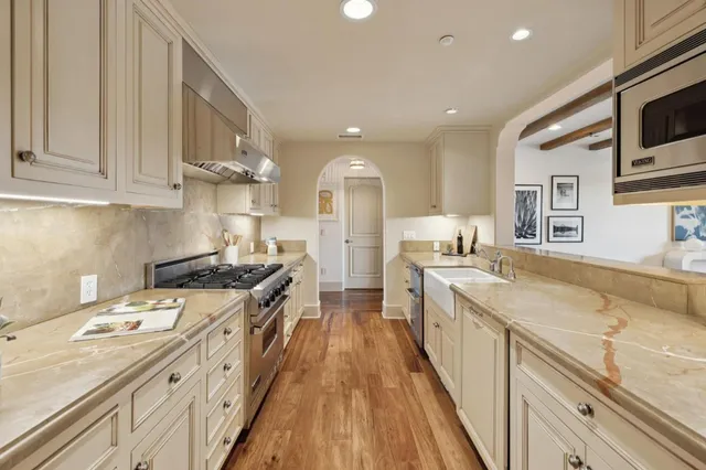 a bedroom with a bed and a potted plant