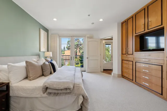 a view of a hallway view with wooden floor and staircase