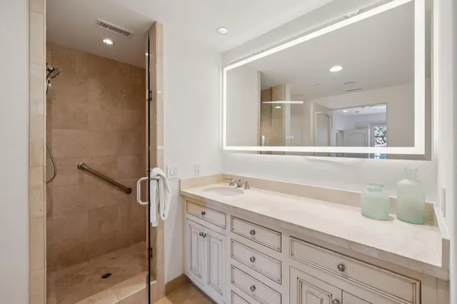 a view of a balcony with chairs and wooden floor