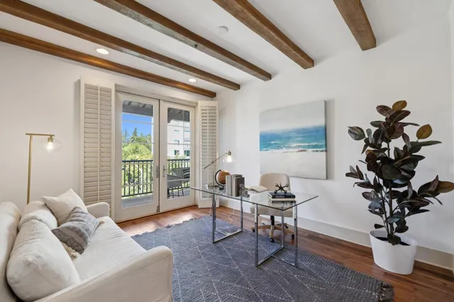 a view of parking garage with cars parked