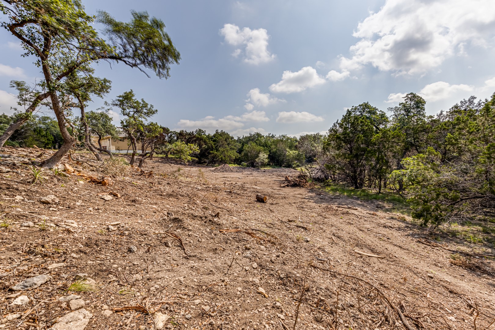 1252 Parton Road Canyon Lake, TX 78133 - Photo 10 of 11 a view of a dry yard with wooden fence