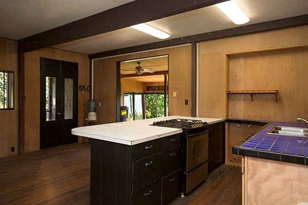 44-3173 Kalaniai Road Honokaa, HI 96727 - Photo 15 of 15 a kitchen with a sink and a refrigerator