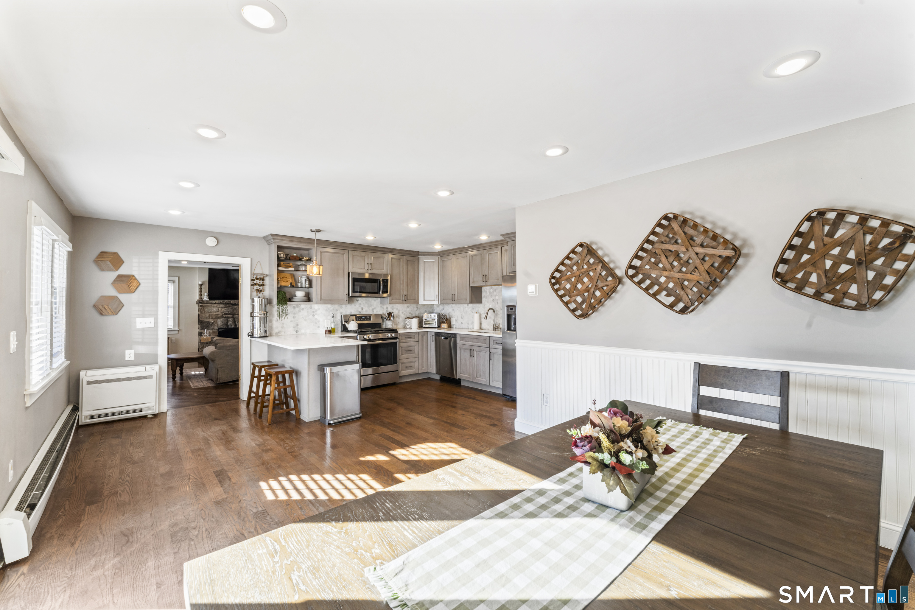 5 Hampton Road New Fairfield, CT 06812 - Photo 16 of 30 a living room with lots of furniture and kitchen view