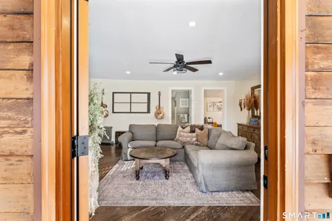 a living room with furniture and a large window