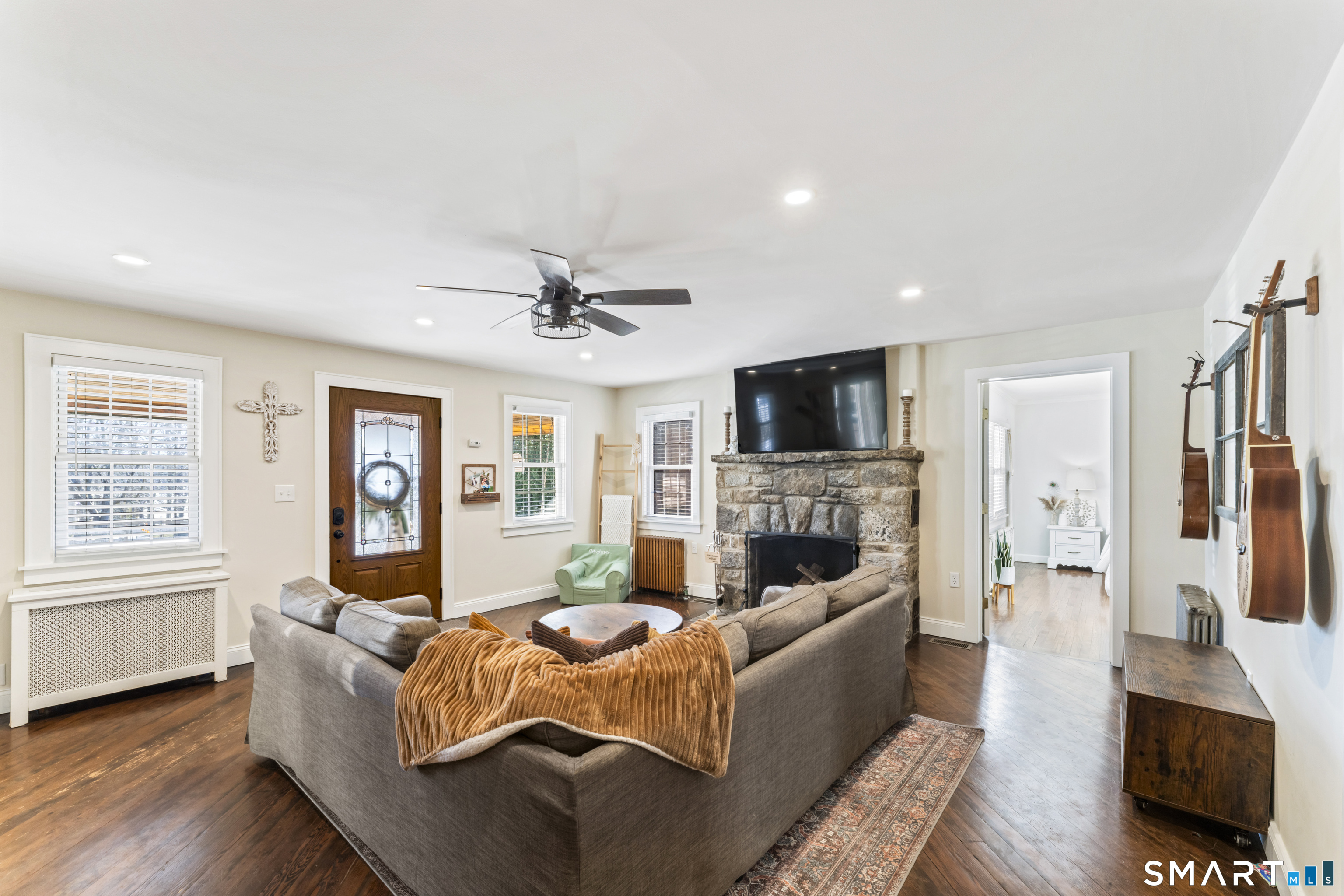 5 Hampton Road New Fairfield, CT 06812 - Photo 5 of 30 a living room with furniture fireplace and flat screen tv