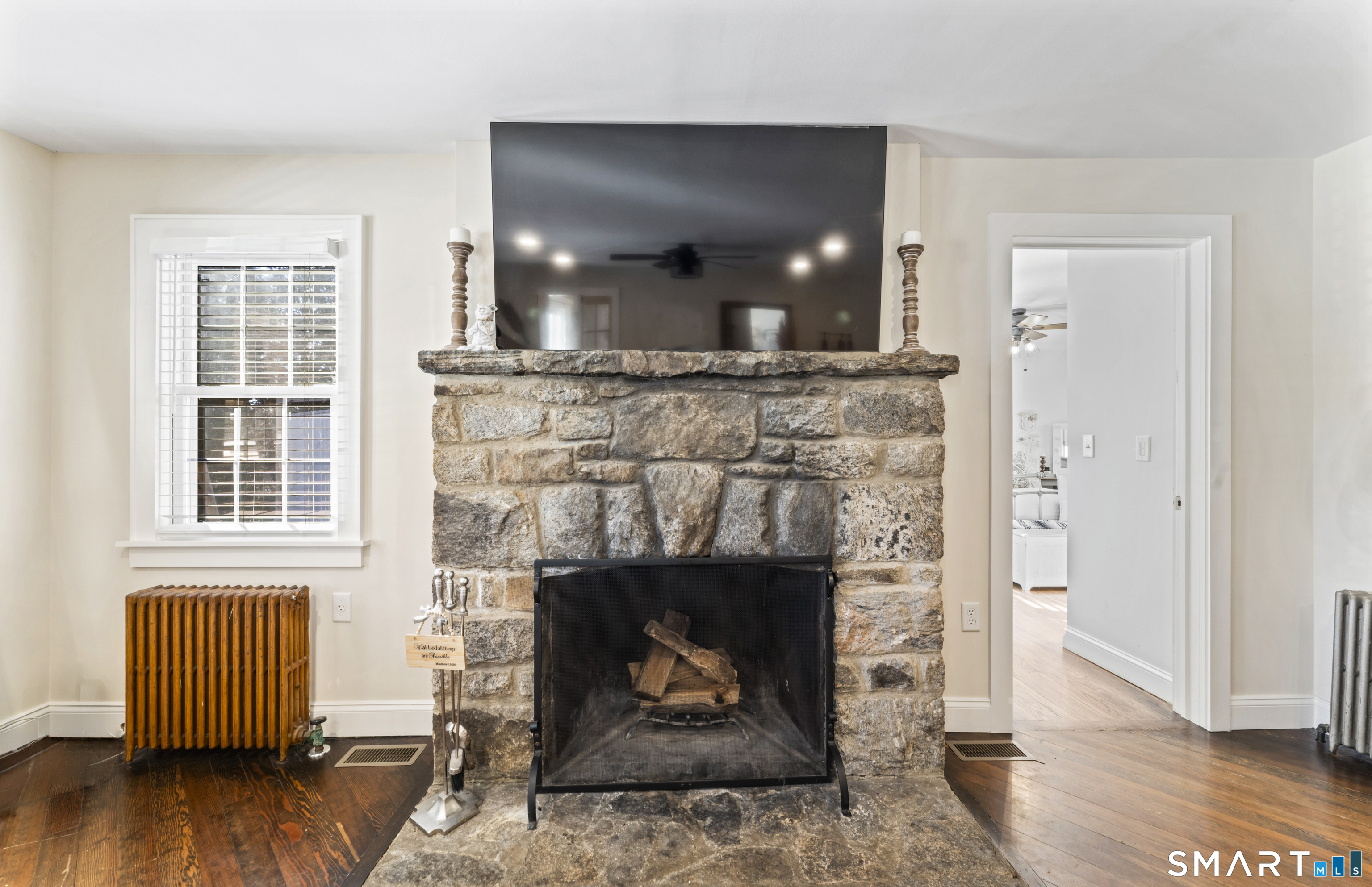 5 Hampton Road New Fairfield, CT 06812 - Photo 6 of 30 a living room with furniture and a fireplace