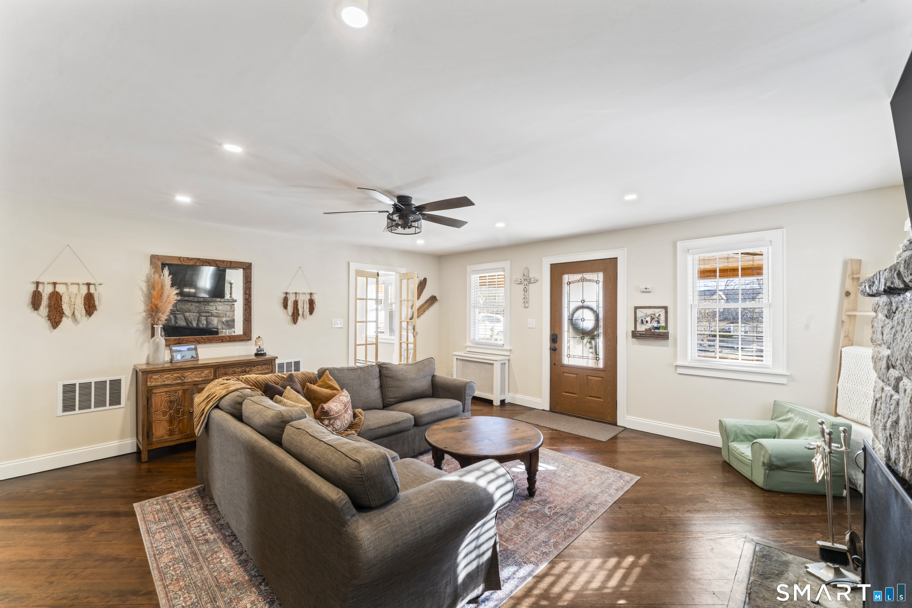 5 Hampton Road New Fairfield, CT 06812 - Photo 7 of 30 a living room with furniture and wooden floor