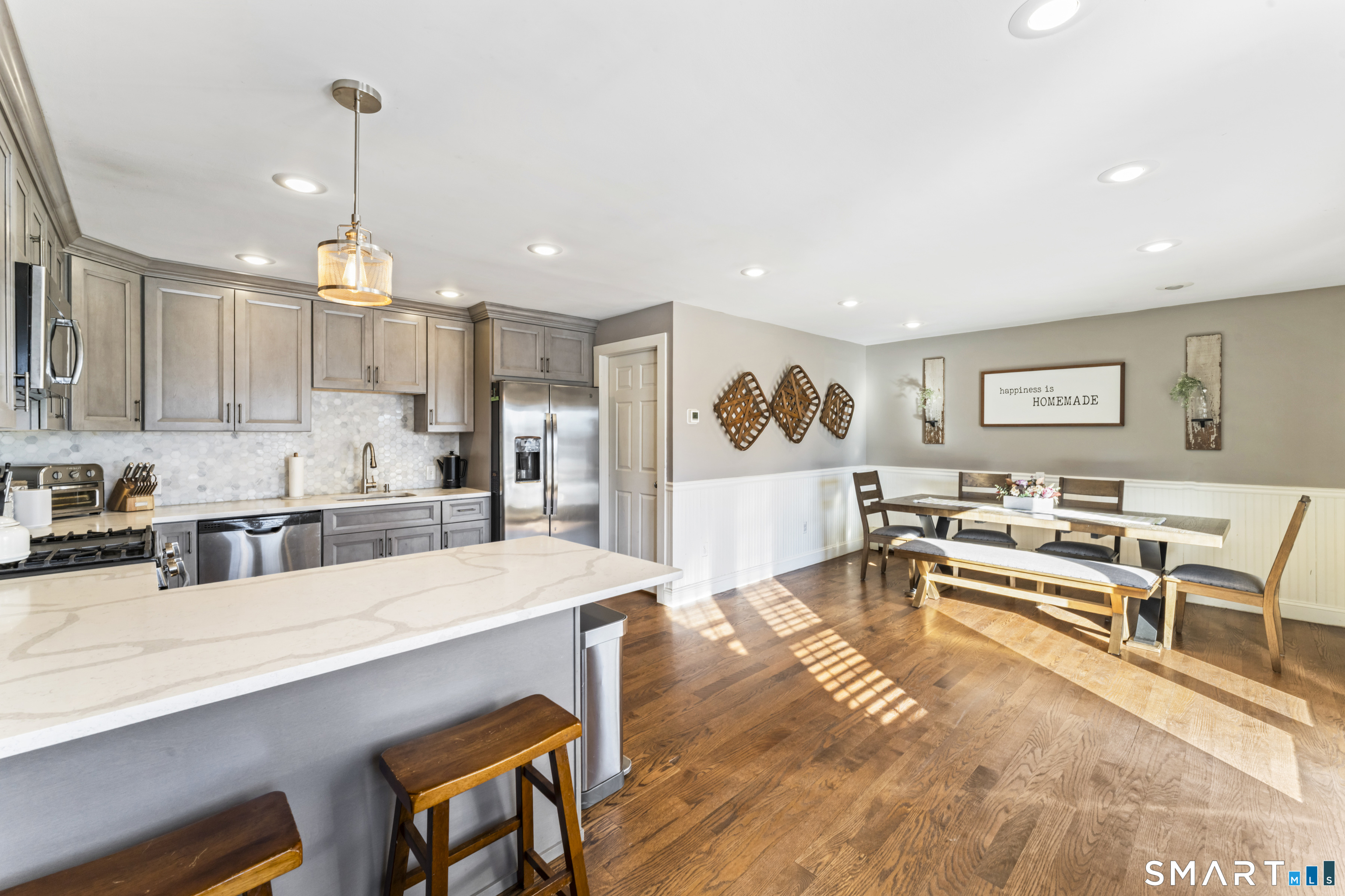 5 Hampton Road New Fairfield, CT 06812 - Photo 9 of 30 a living room with stainless steel appliances kitchen island granite countertop furniture and a kitchen view