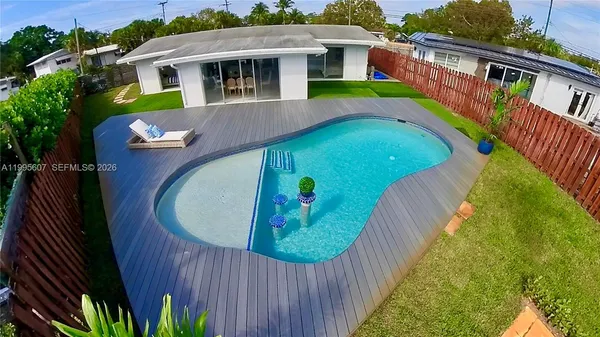 a view of swimming pool with a balcony
