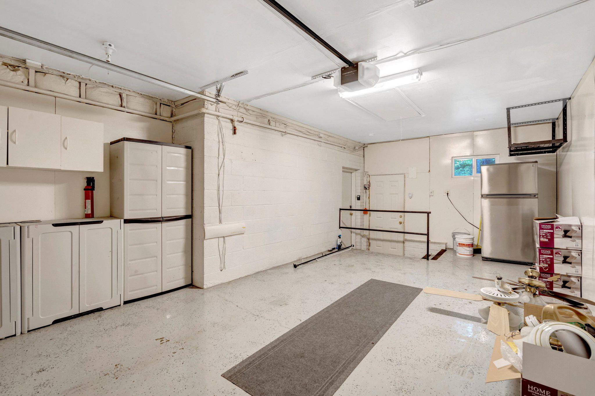 8213 Springfield Village Drive Springfield, VA 22152 - Photo 25 of 25 Garage with storage and epoxy floors
