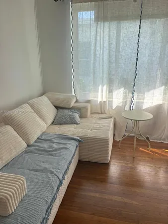 a bedroom with a bed and a ceiling fan