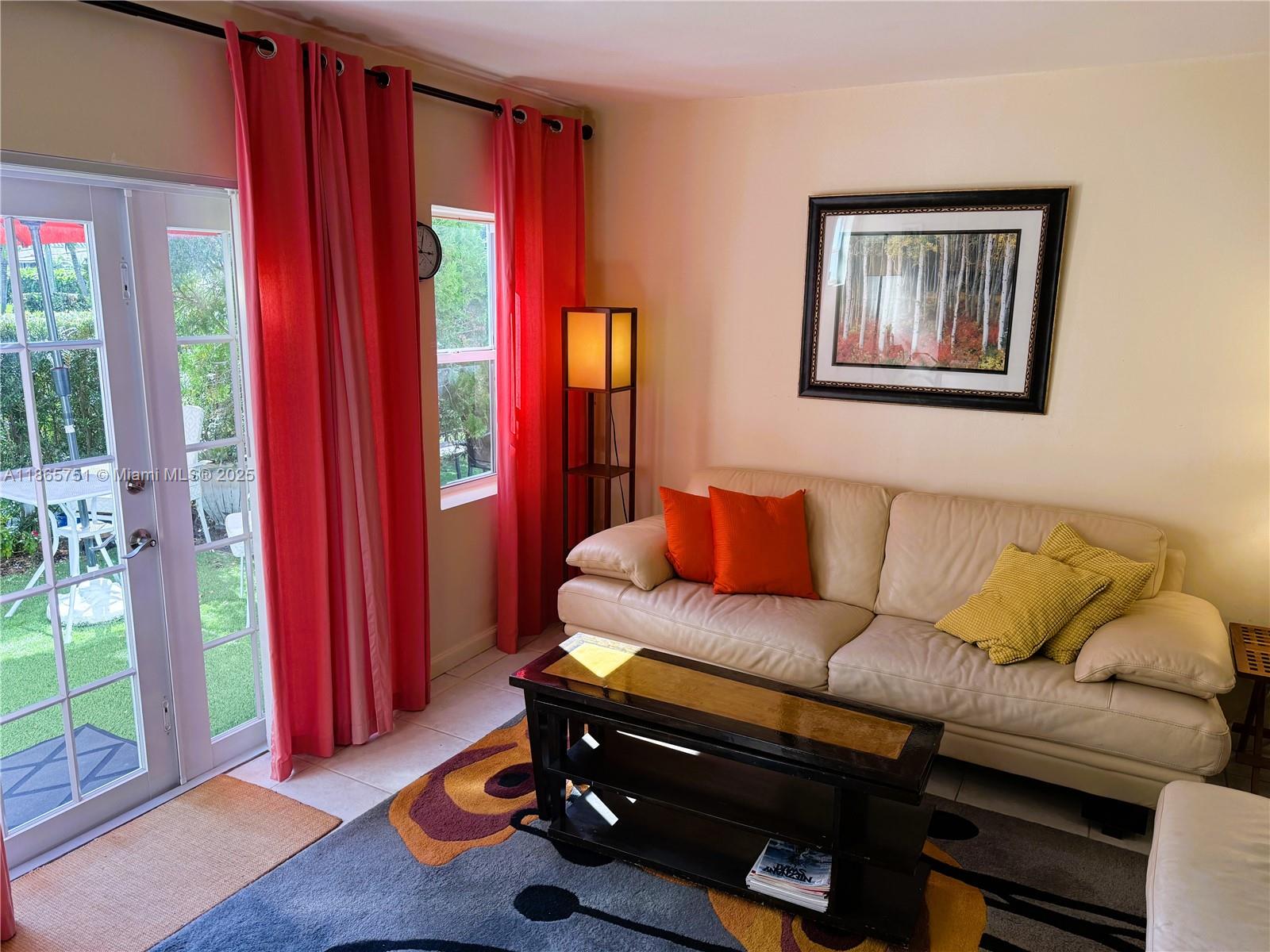 931 Northeast 4th Street, Unit 2 Boca Raton, FL 33432 - Photo 4 of 16 a living room with furniture and a wooden floor