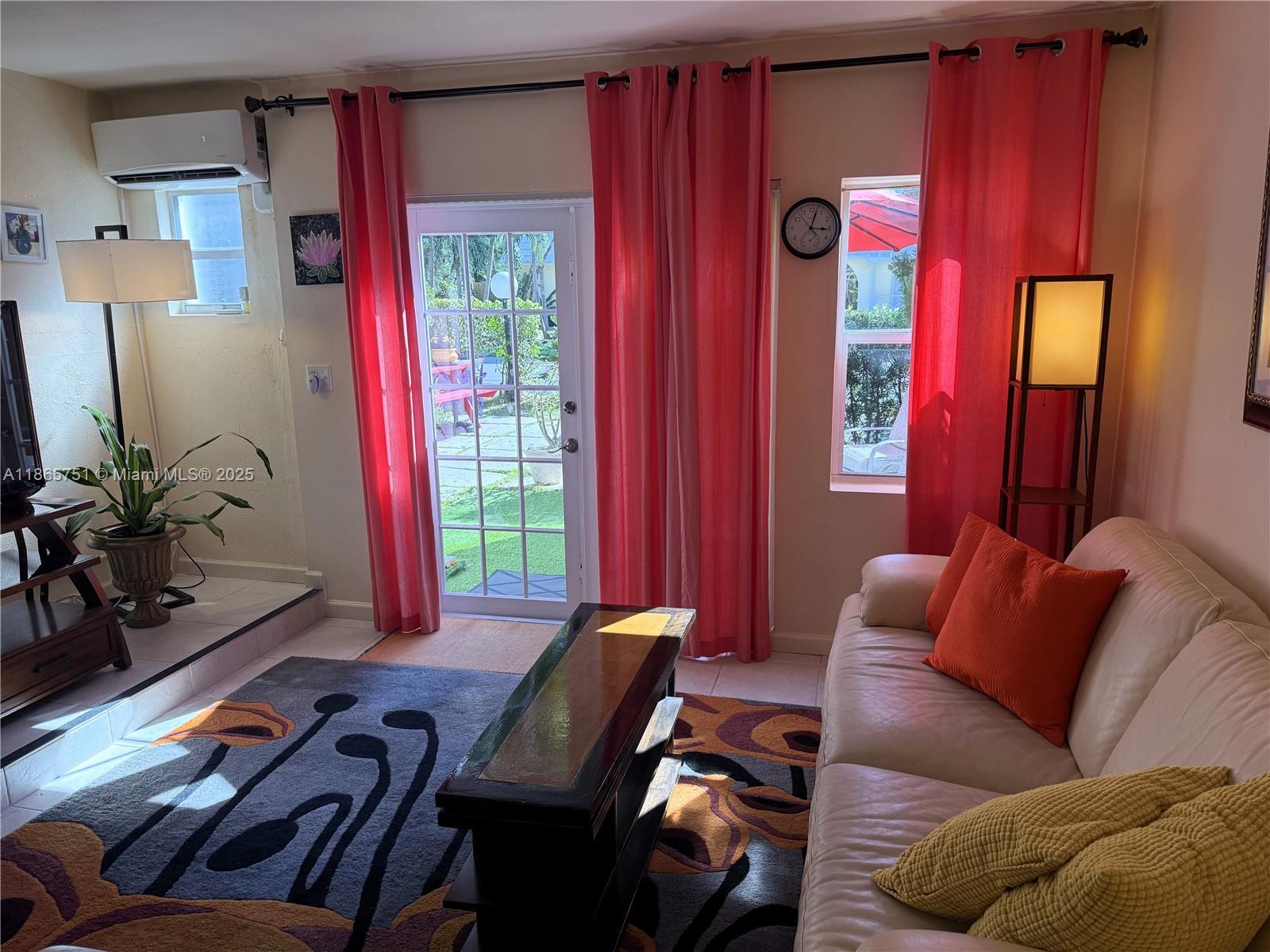 931 Northeast 4th Street, Unit 2 Boca Raton, FL 33432 - Photo 5 of 16 a living room with furniture and a window