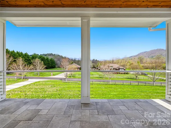 a view of a swimming pool with a yard