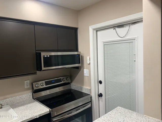 a kitchen with a stove and a microwave