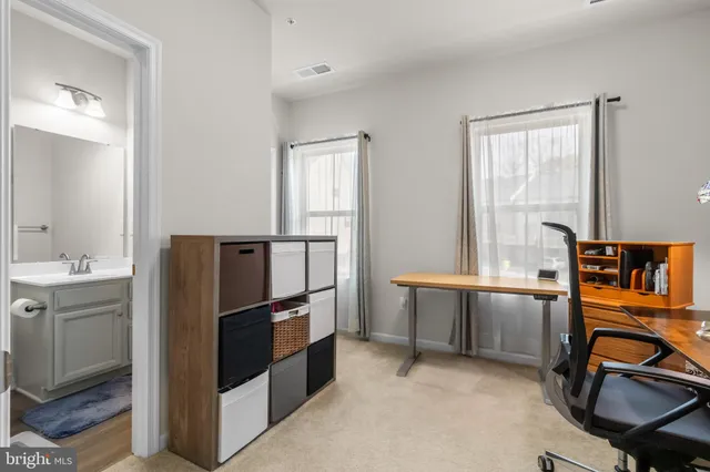 a kitchen with stainless steel appliances granite countertop a refrigerator and a stove