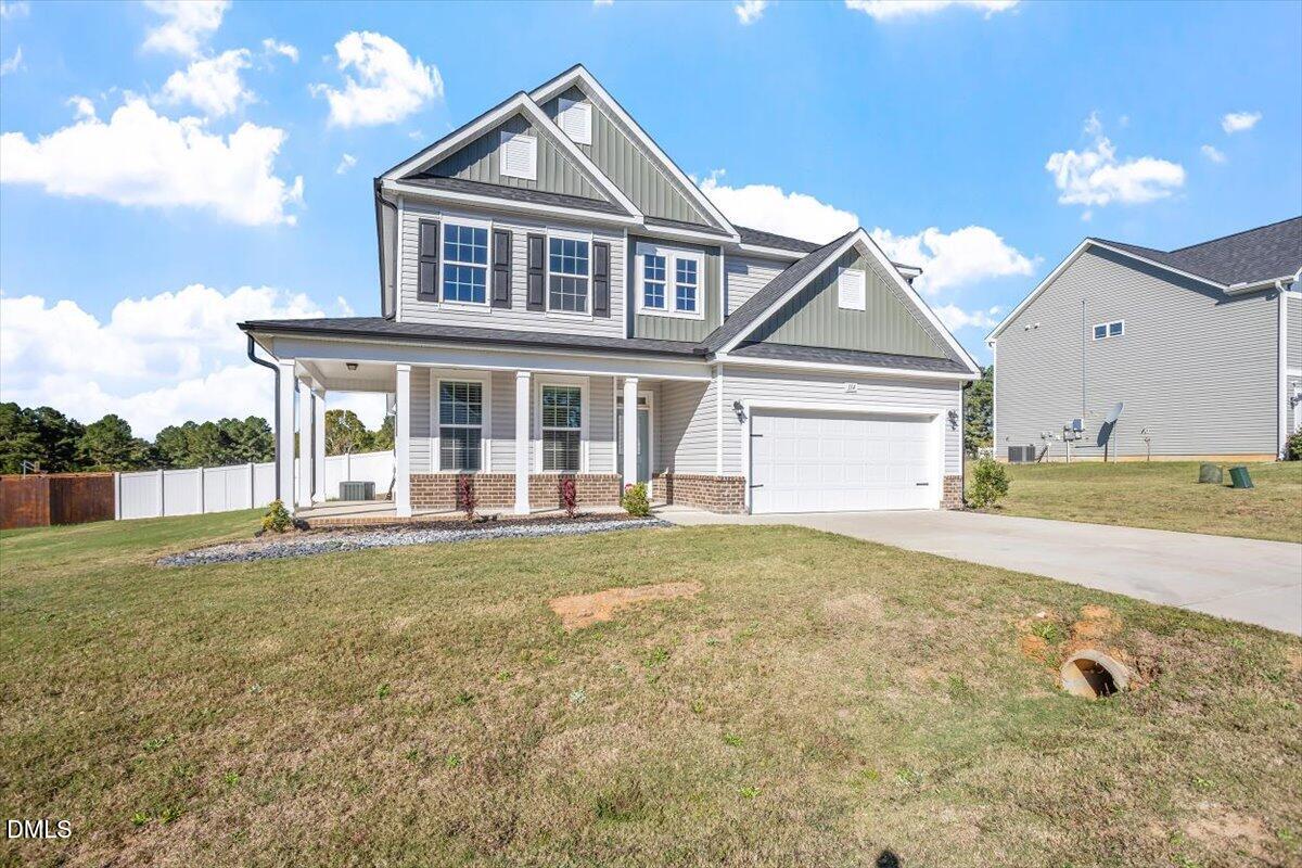 114 Stephens Timberline View Clayton, NC 27520 - Photo 3 of 43 a front view of a house with a yard