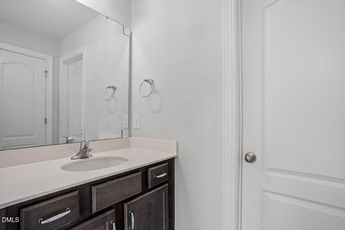 114 Stephens Timberline View Clayton, NC 27520 - Photo 42 of 43 a bathroom with a sink and a mirror
