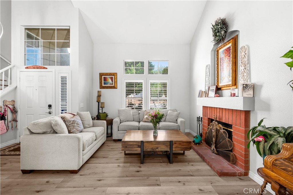 19465 Kinnow Lane Riverside, CA 92508 - Photo 7 of 61 a living room with fireplace furniture and a window
