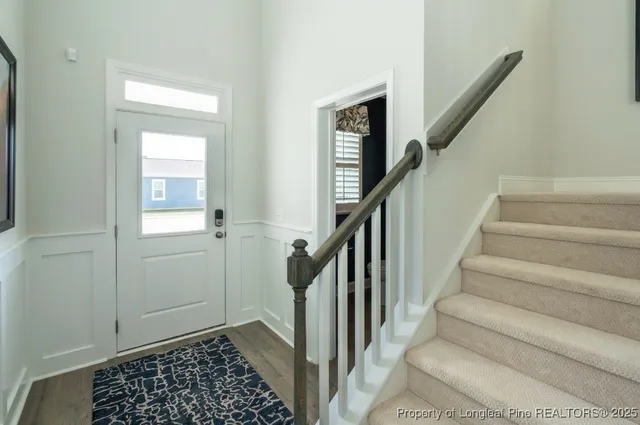 a view of entryway with stairs