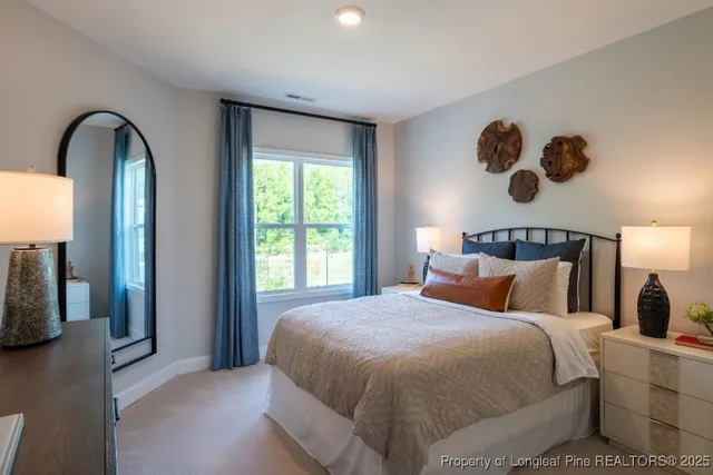 a bedroom with a large bed and a large window