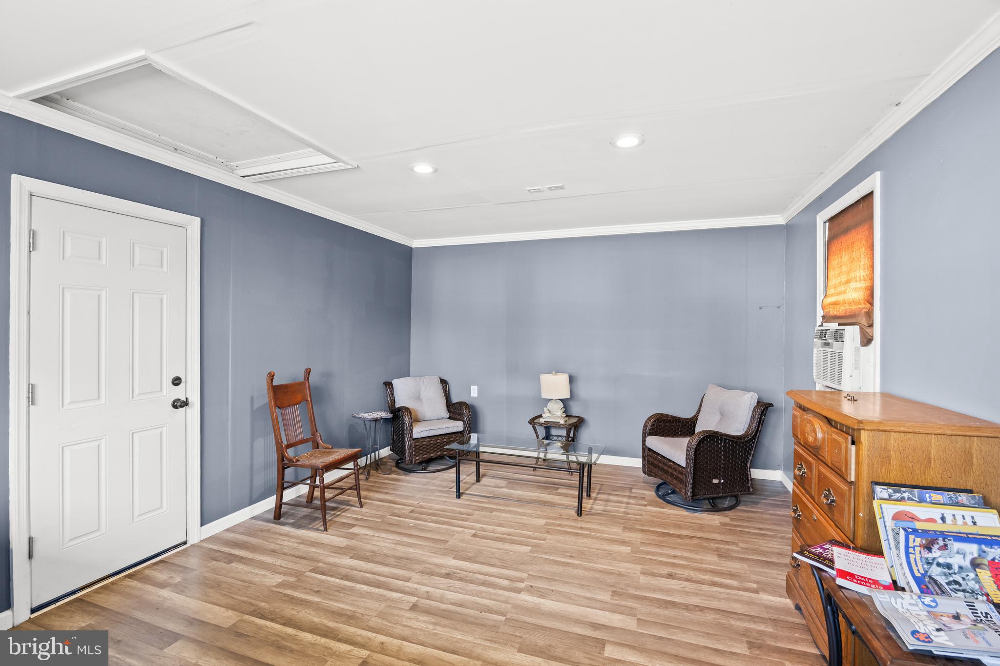 615 North Walnut Avenue Magnolia, NJ 08049 - Photo 32 of 40 a living room with furniture and a wooden floor