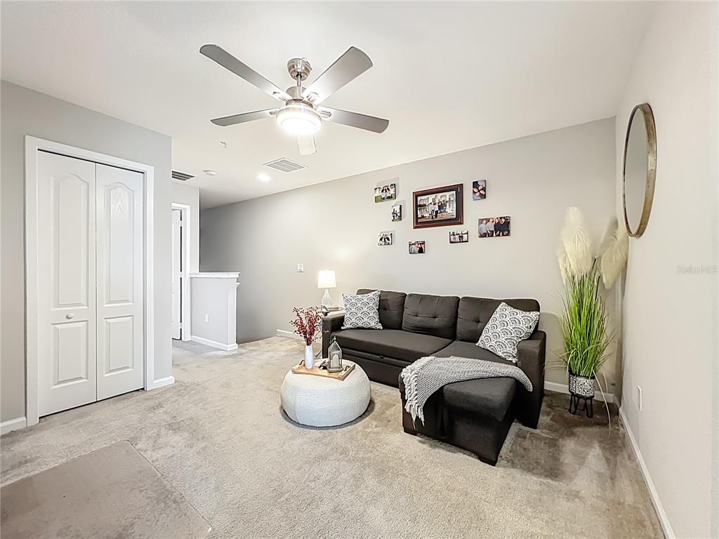 381 Smugglers Way Apopka, FL 32712 - Photo 27 of 53 a living room with furniture and a window