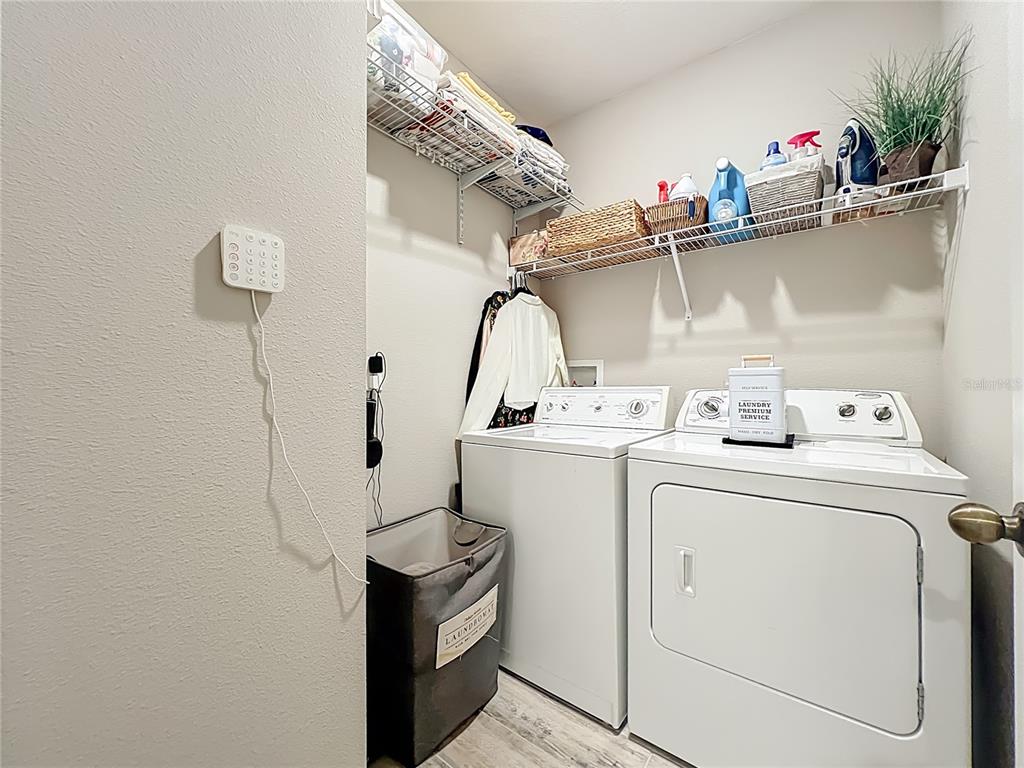 381 Smugglers Way Apopka, FL 32712 - Photo 43 of 53 a utility room with dryer and washer