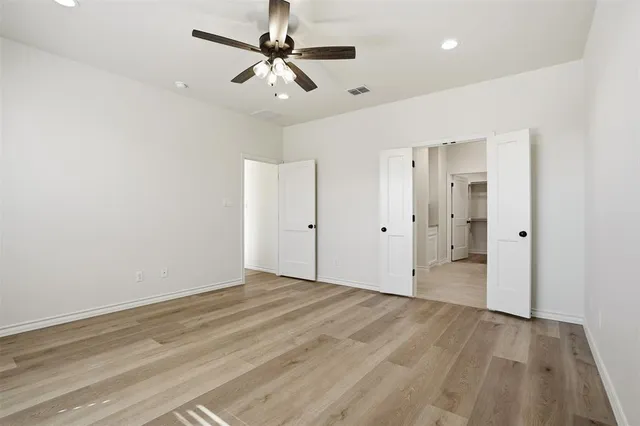 a bathroom with a shower sink and mirror