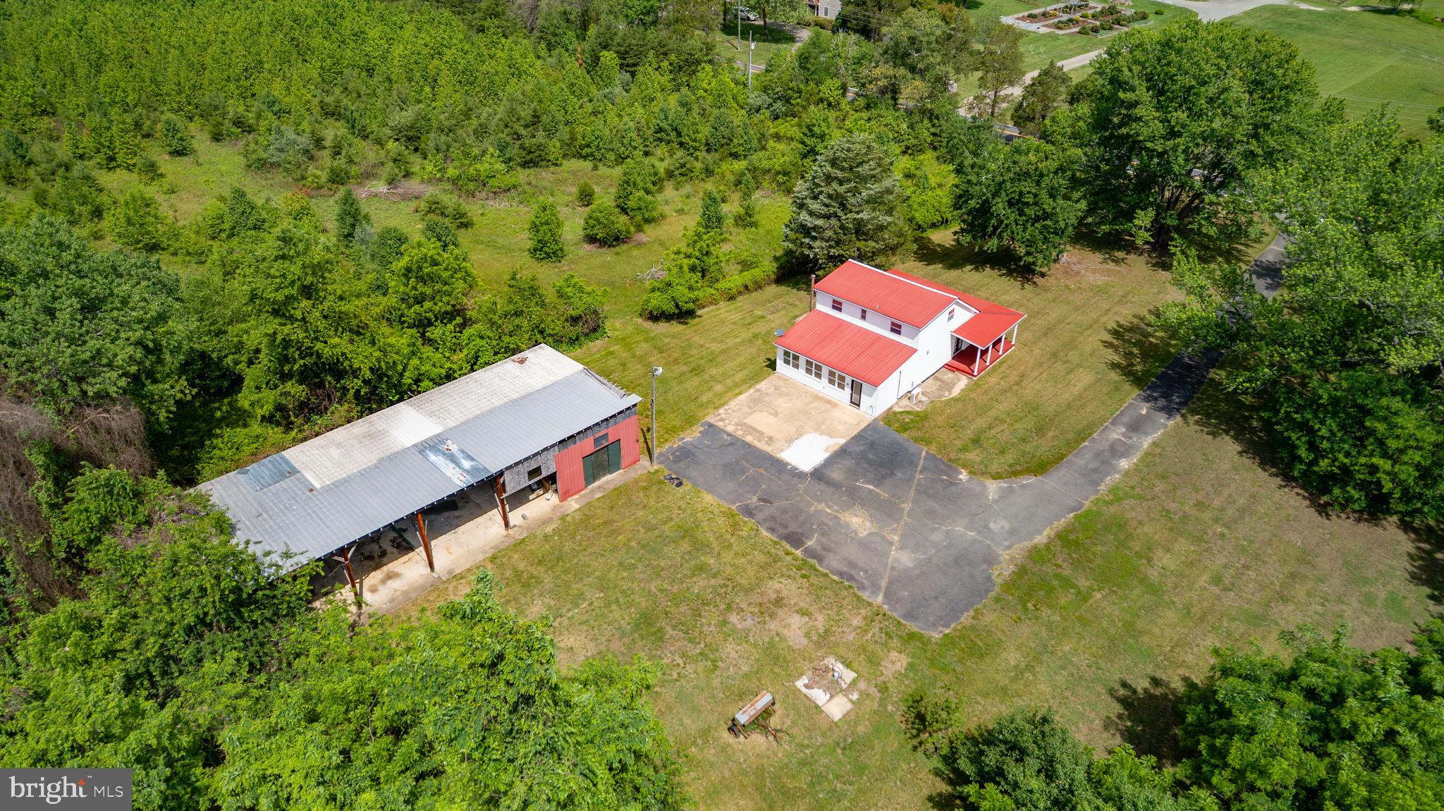 10827 Catharpin Road Spotsylvania, VA 22553 - Photo 2 of 39 an aerial view of a house with a yard