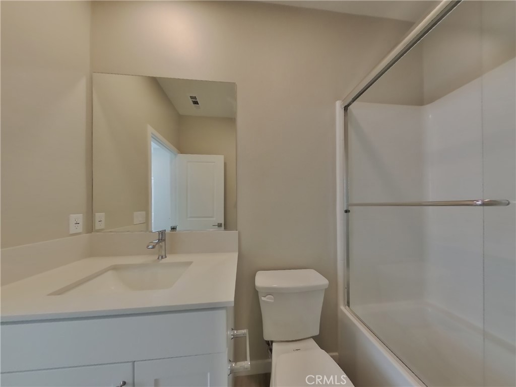 24970 Vermijo Court Wildomar, CA 92595 - Photo 11 of 28 a bathroom with a sink toilet and shower
