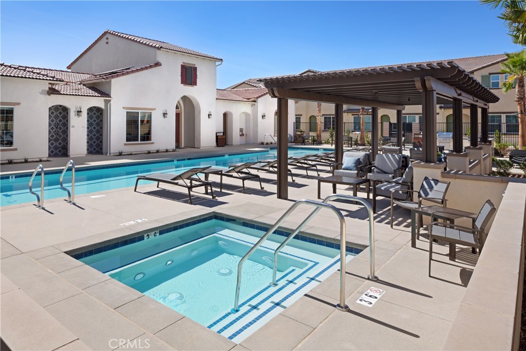 24970 Vermijo Court Wildomar, CA 92595 - Photo 18 of 28 a view of a patio with table and chairs with wooden floor and fence