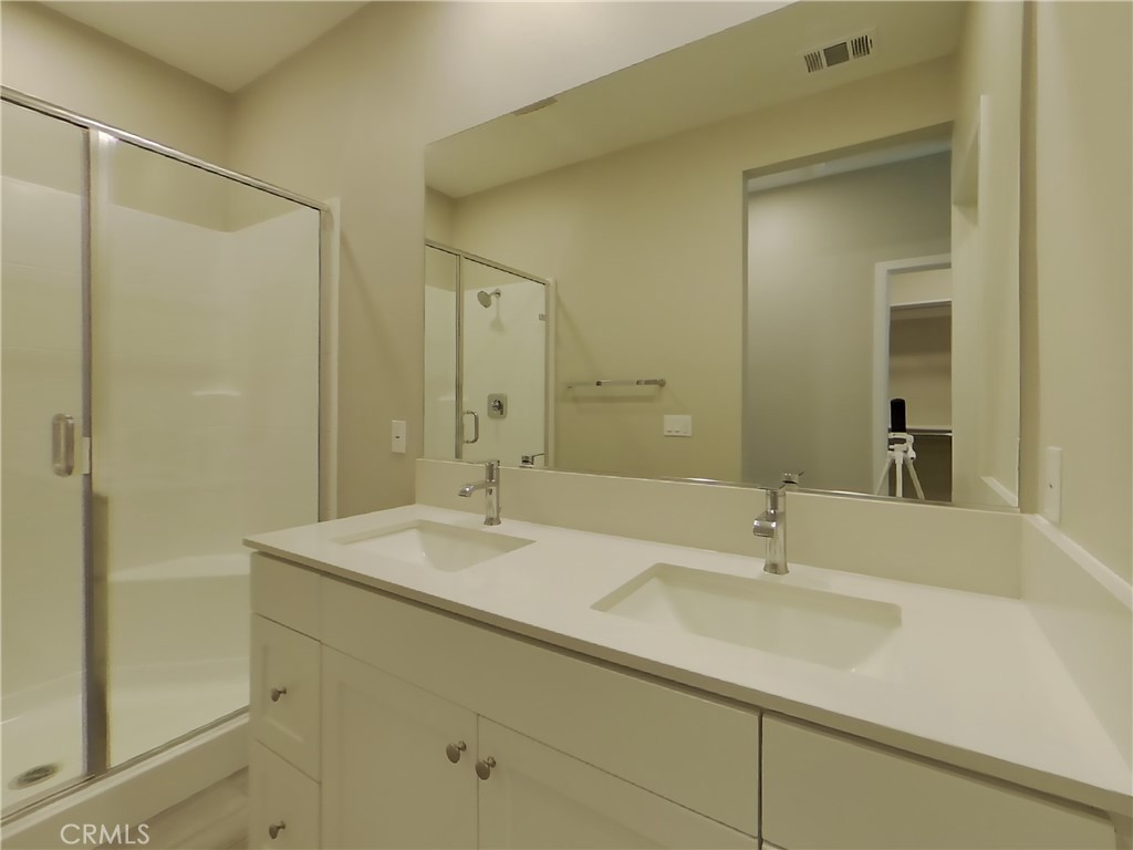 24970 Vermijo Court Wildomar, CA 92595 - Photo 7 of 28 a bathroom with a sink and a mirror