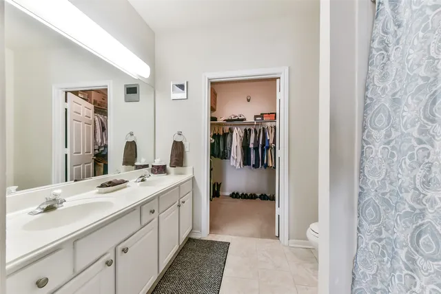 a spacious bathroom with a sink double vanity