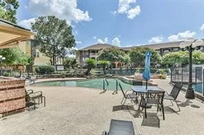 a view of a lake with houses in the back