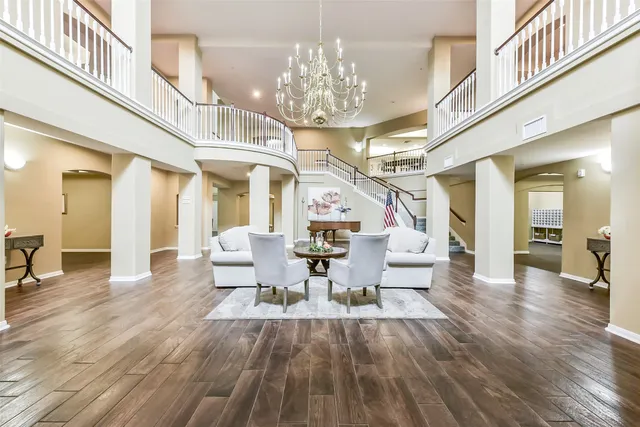 a lobby with furniture and wooden floor