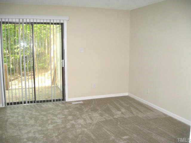 609 Brent Road Raleigh, NC 27606 - Photo 5 of 10 First floor master bedroom with his/hers closets, ceiling fan, & access to deck Other