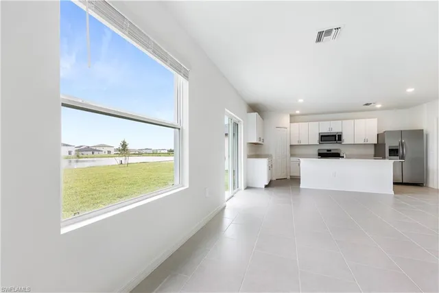 a view of a kitchen with a stove top oven