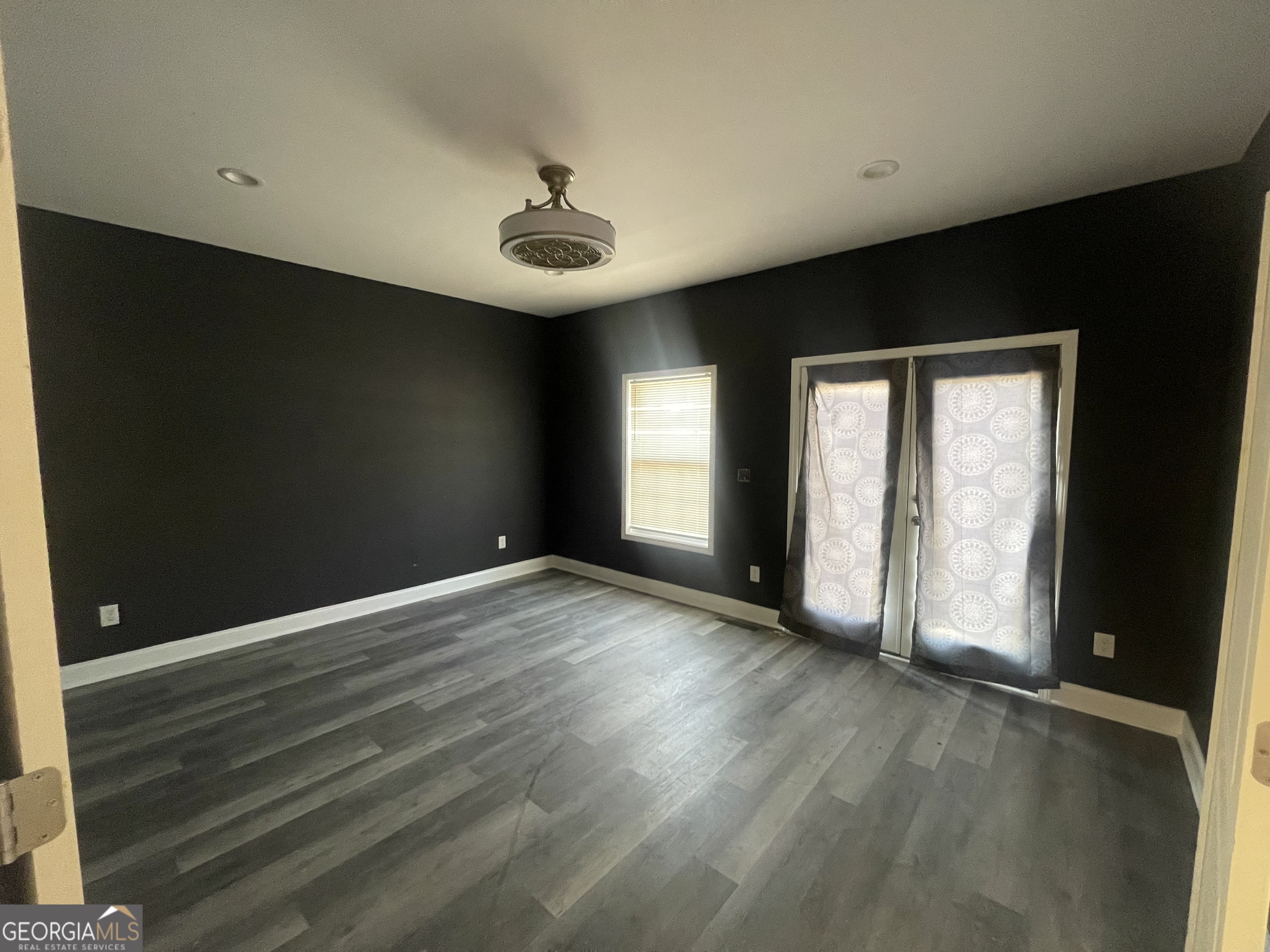 2889 Battlecrest Drive Decatur, GA 30034 - Photo 3 of 14 an empty room with wooden floor and windows