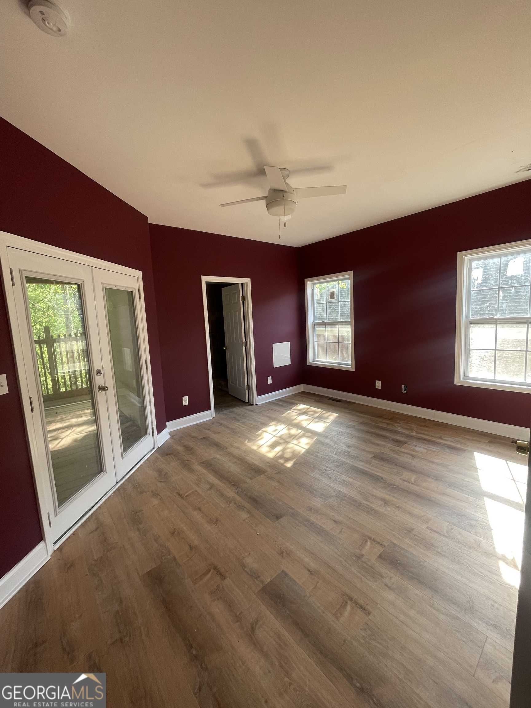 2889 Battlecrest Drive Decatur, GA 30034 - Photo 6 of 14 a view of an empty room with window and wooden floor