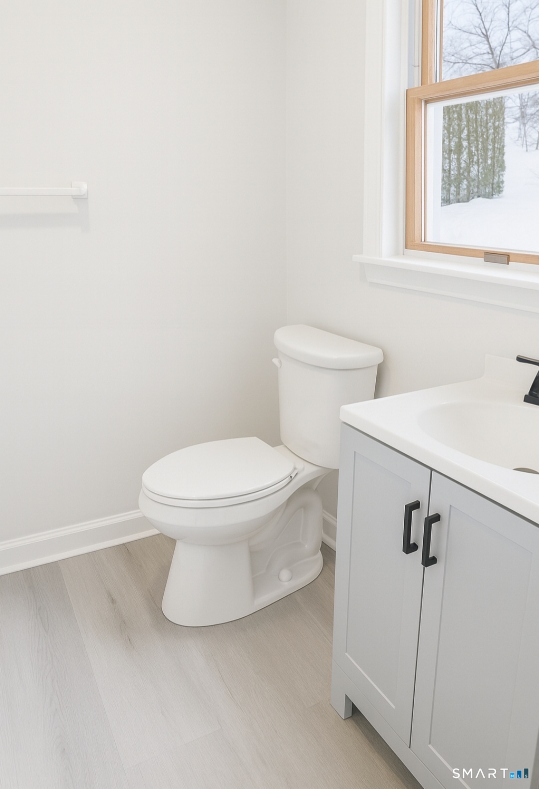 316 High Road Berlin, CT 06037 - Photo 14 of 20 a white toilet sitting next to a bathroom sink
