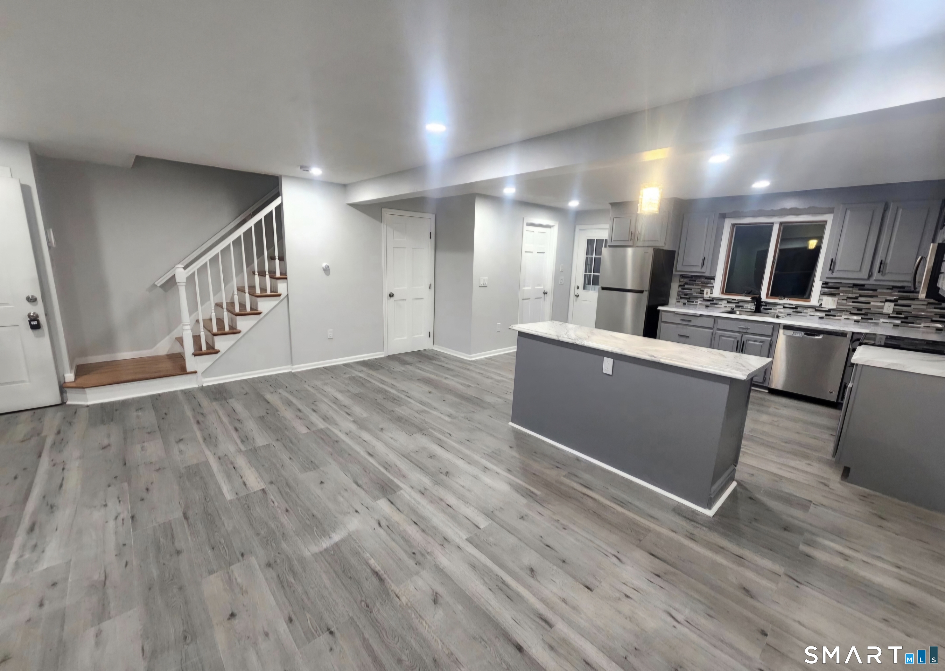 316 High Road Berlin, CT 06037 - Photo 4 of 20 a view of a kitchen center island wooden floor and living room