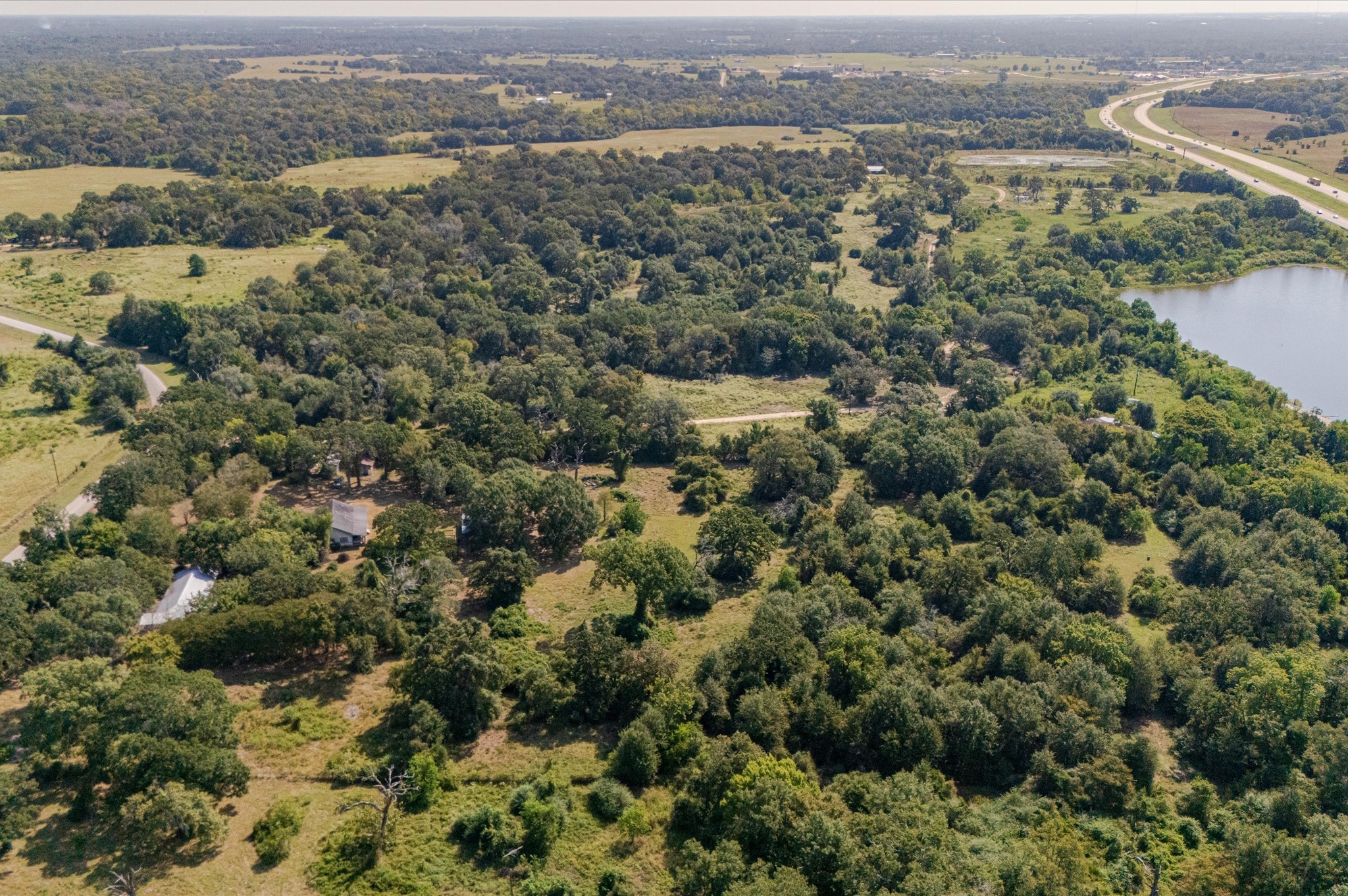 42109 Blumberg Road Hempstead, TX 77445 - Photo 3 of 6 an aerial view of residential houses with outdoor space and trees