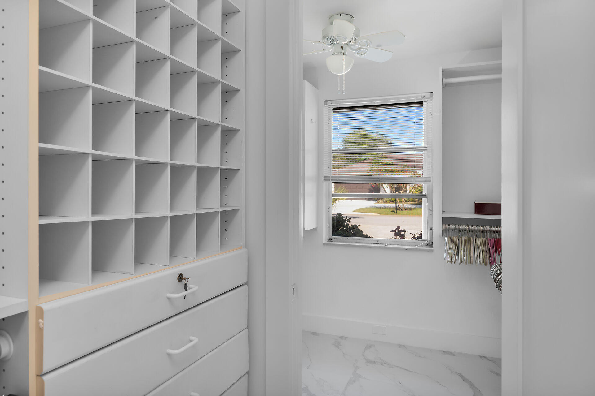178 Torrey Pines Naples, FL 34113 - Photo 19 of 48 a view of walk in closet with empty racks