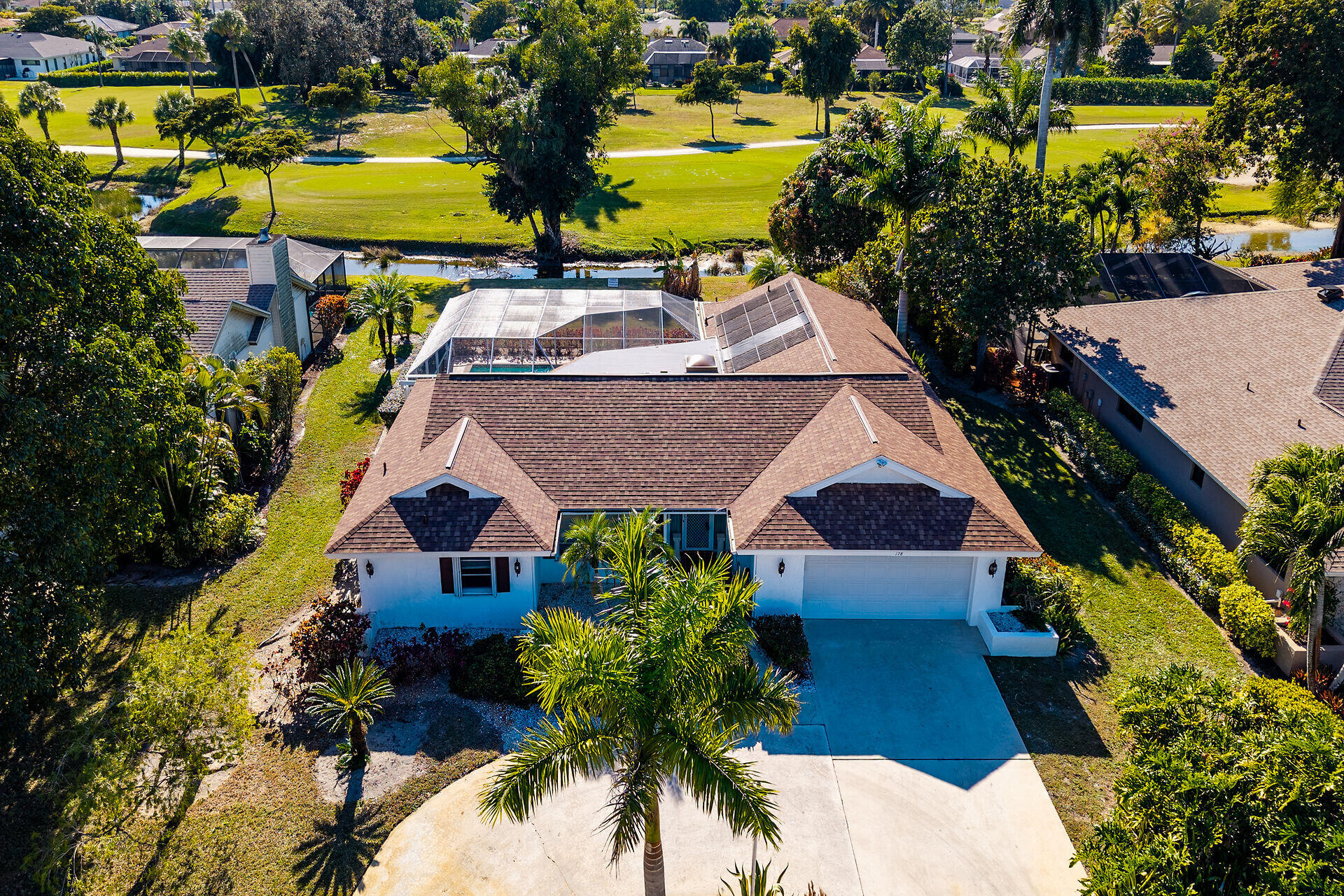 178 Torrey Pines Naples, FL 34113 - Photo 35 of 48 a aerial view of a house with a yard