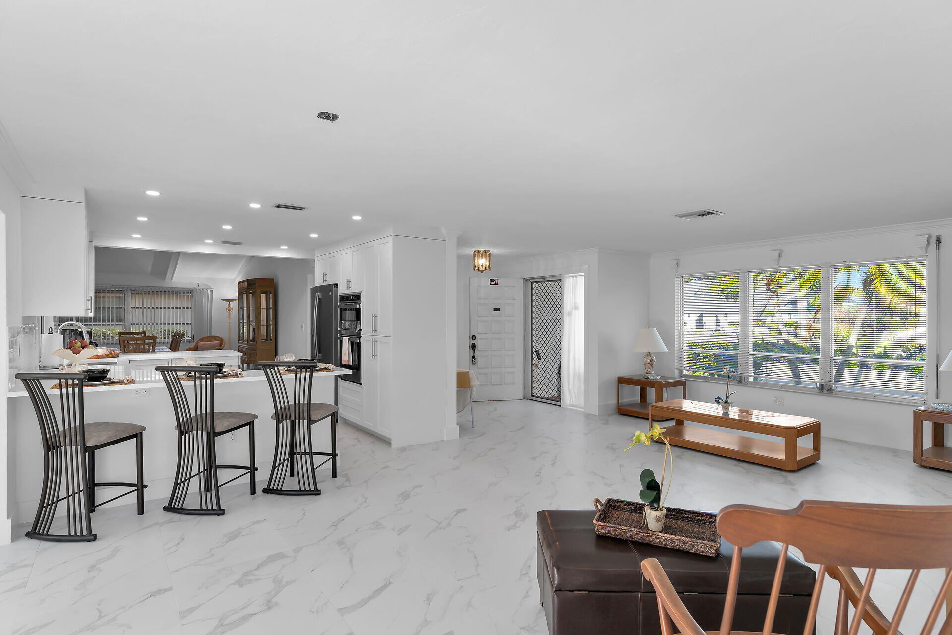 178 Torrey Pines Naples, FL 34113 - Photo 5 of 48 a room with lots of furniture and a large window