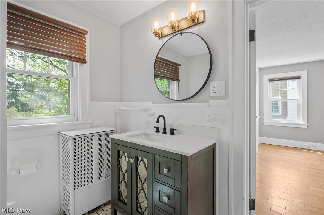 2924 Brighton Road Shaker Heights, OH 44120 - Photo 23 of 31 Bathroom with plenty of natural light, vanity, wainscoting, and wood finished floors