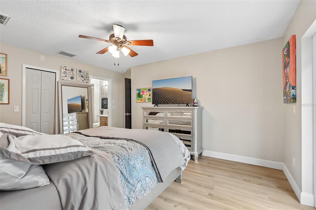 1525 Kestrel Way Brandon, FL 33511 - Photo 24 of 48 a bedroom with a bed and a flat screen tv